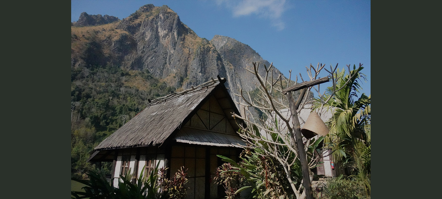 Bungalow and mountain across Ou River in Nong Khiaw